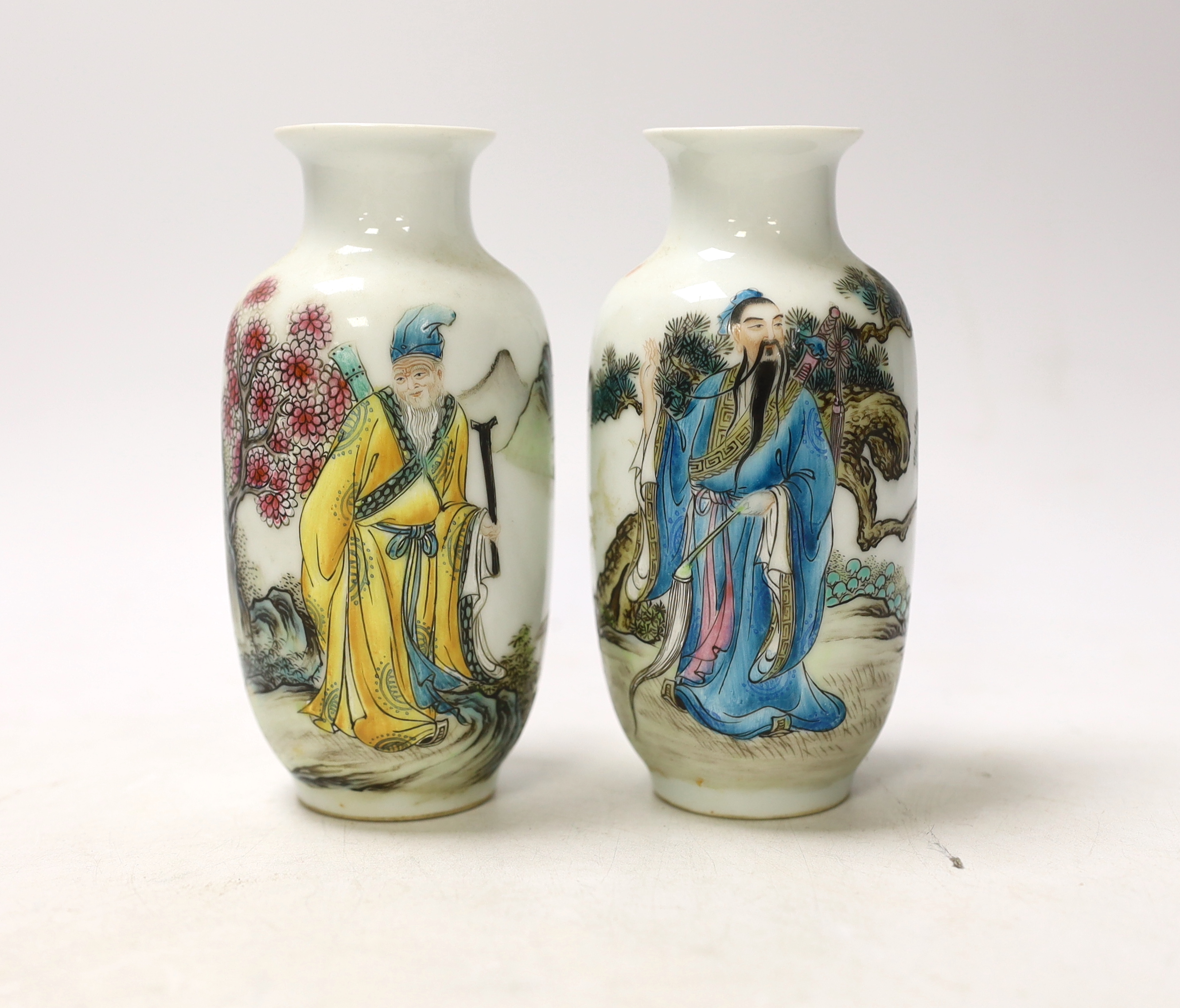 A pair of small Chinese famille verte vases, Qianlong marks but Republic period, depicting Lu Dongbin and Li Tieguai, 13cm